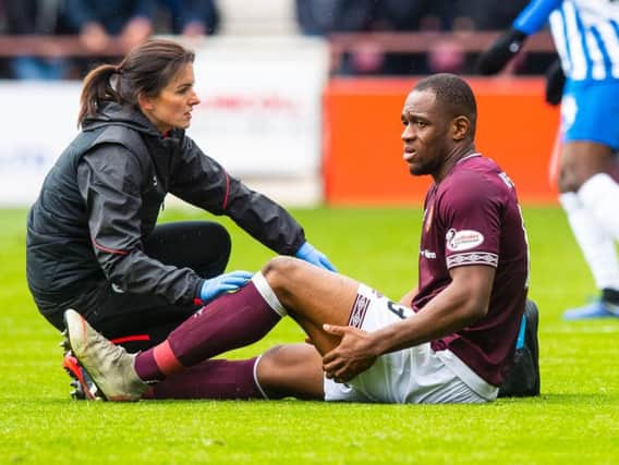 Hearts striker Uche Ikpeazu is grounded after appearing to injure his hamstring against Kilmarnock