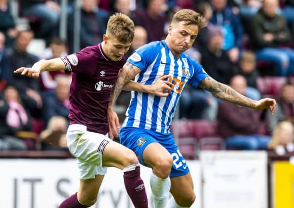 Hearts' Harry Cochrane (left) and Kilmarnock's Eamonn Brophy in action. Pic: SNS