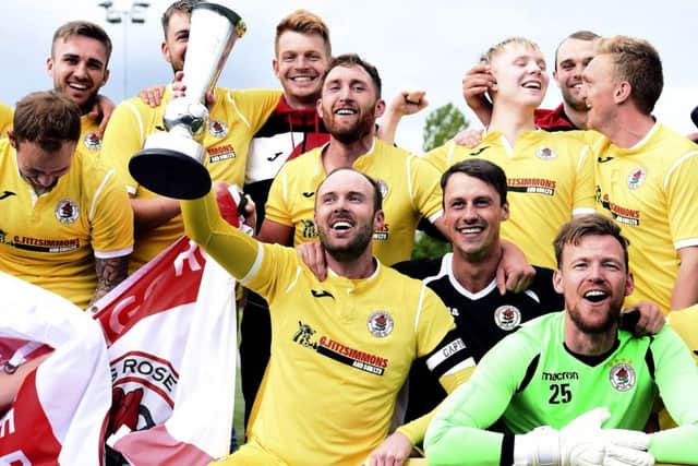 The Bonnyrigg players celebrate after being crowned East of Scotland League champions. Pic: Lisa Ferguson