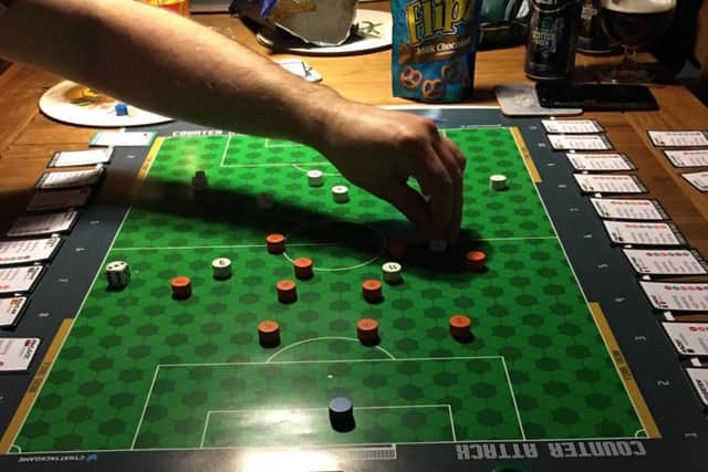 It combines the fast paced action of Subbuteo with the tabletop strategy of classic board games such as Risk.