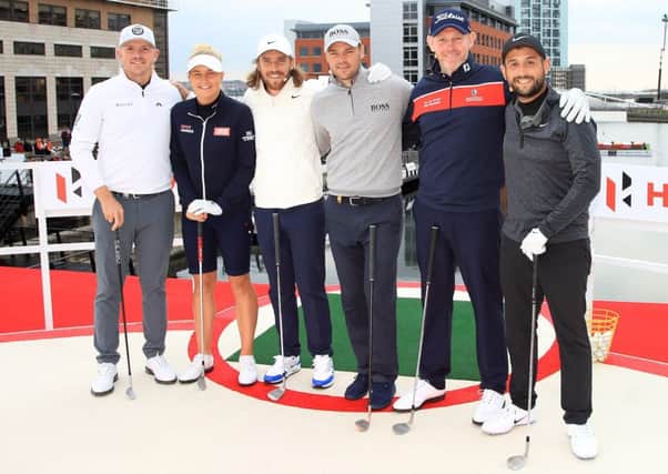Stephen Gallacher, second right, lines up with, from left, Matt Wallace, Charley Hull, Tommy Fleetwood, Martin Kaymer of Germany and Alex Levy ahead of the Hero Challenge