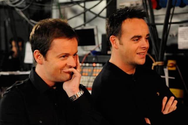 Ant McPartlin, right, with his co-host Declan Donnelly. Picture: PA Photo/
TalkBack Thames/Ken McKay