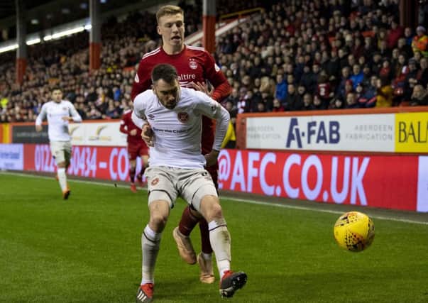 Hearts' Michael Smith holds off Aberdeen's Lewis Ferguson