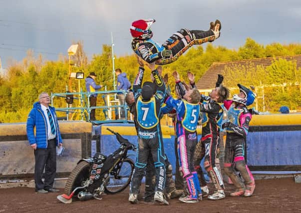 Ricky Wells gets the bumps from his Monarchs team-mates to celebrate his paid maximum as team boss Alex Harkess watches on. Pic: Ron MacNeill