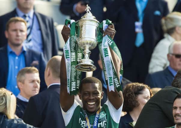 Marvin Bartley lifts the Scottish Cup as Hibs celebrate their historic win in May 2016. Picture: SNS Group