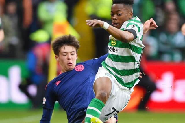 Two 16-year-olds - Hearts' Aaron Hickey and Celtic debutant Karamoko Dembele - in action at Celtic Park.