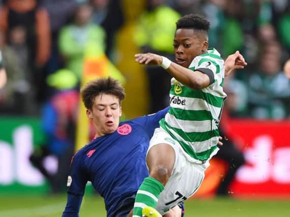 Two 16-year-olds - Hearts' Aaron Hickey and Celtic debutant Karamoko Dembele - in action at Celtic Park.