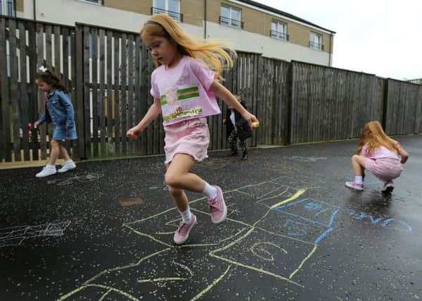 Families at the housing development in Bishopbriggs, East Dunbartonshire, were sent a letter by the property factor demanding children stop using chalk - which they play hopscotch with. Picture: Glasgow Evening Times/SWNS