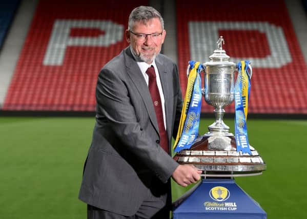 Craig Levein with the Scottish Cup. He is desperate for it to return to Tynecastle