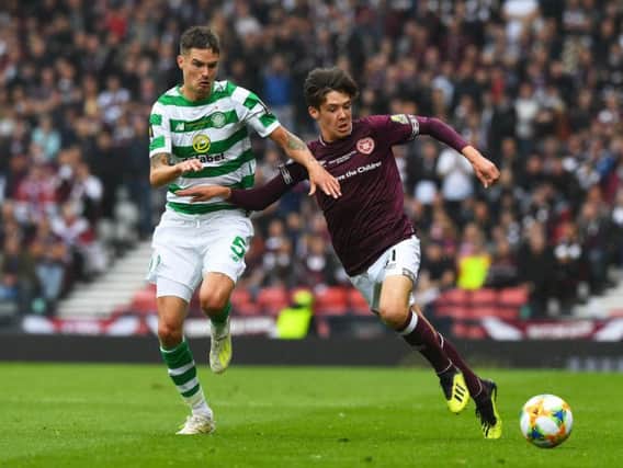 Hearts teenager Aaron Hickey with Celtic defender Mikael Lustig at Hampden