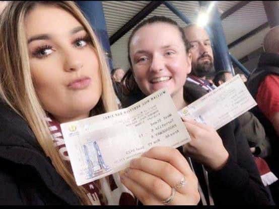 Laura Hunter and her friend, Britney Anderson, holding their tickets. Pic: contributed