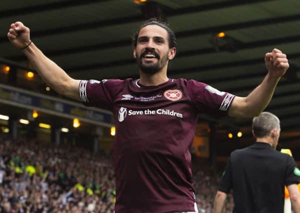 Ryan Edwards celebrates after making it 1-0 to Hearts at Hampden