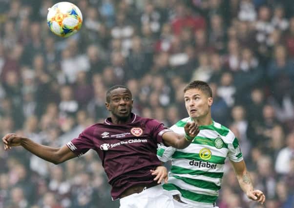 Arnaud Djoum challenges Celtic defender Mikael Lustig during Saturday's Scottish Cup final
