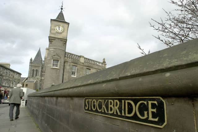 The current stone-built "Stock Bridge" crossing dates from 1801 and spans the Water of Leith.