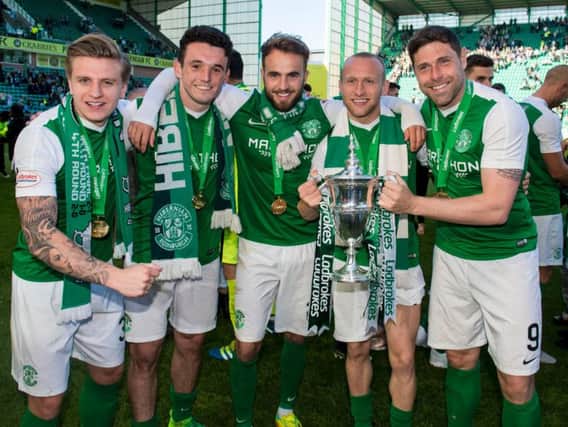 Grant Holt (right) celebrates winning the Scottish Championship with (l-r) Jason Cummings, John McGinn, Andrew Shinnie and Dylan McGeouch