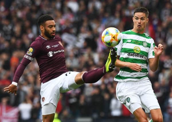 the eyes have it: Jake Mulraney takes the ball away from a rather surprised looking Mikael Lustig at Hamdpen during the Scottish Cup Final