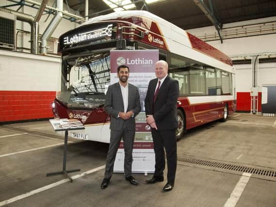 Richard Hall, Managing Director of Lothian buses, pictured here with then Transport Minister, Humza Yousaf, says action is needed to tackle traffic congestion in the Capital.