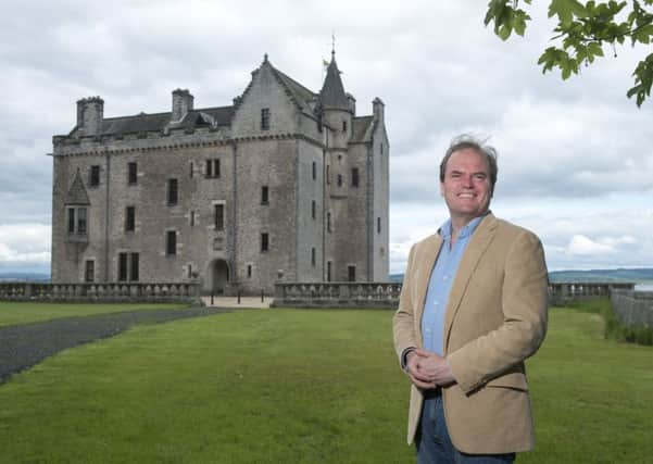 Harry, Lord Dalmeny, with Barnbougle Castle in the background