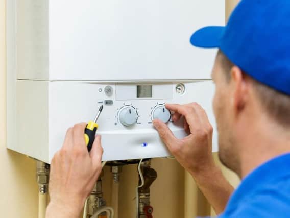 A worker setting up a gas central heating boiler. Pic: ronstik-Shutterstock