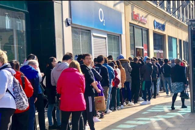 The queues coming from the Princes Street Footlocker this morning. PIC: 291 Media