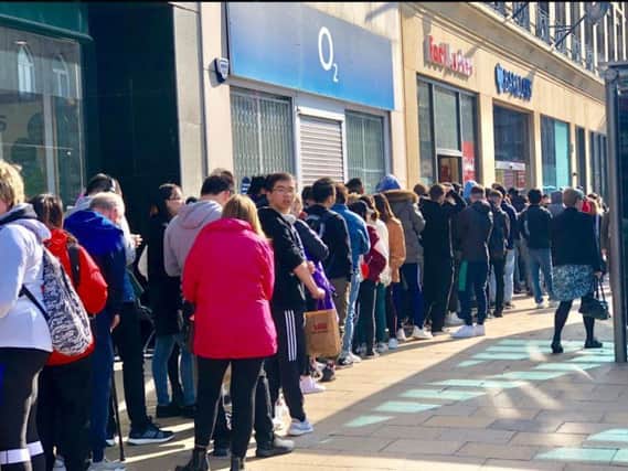 The queues coming from the Princes Street Footlocker this morning. PIC: 291 Media