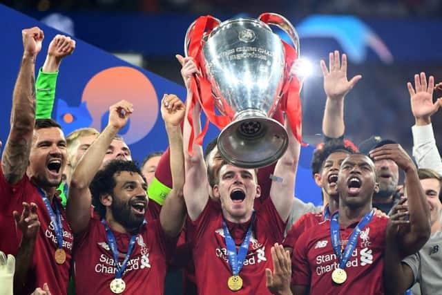 Andy Robertson lifts the Champions League Trophy
