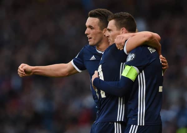Scotland's John McGinn celebrates with Andy Robertson after the latter put the Scots ahead against Cyprus. Pic: SNS