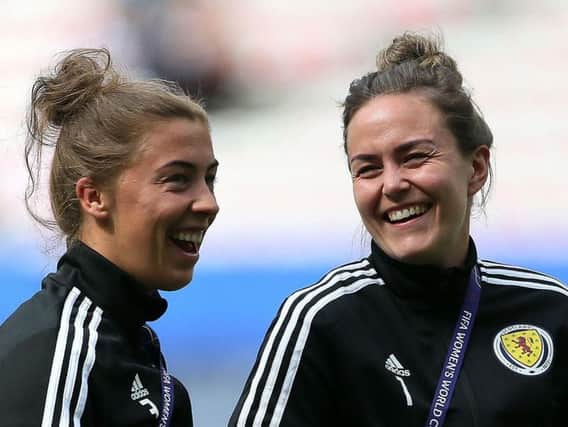 Nicola Docherty and Lee Alexander share a joke ahead of Scotland's World Cup meeting with England