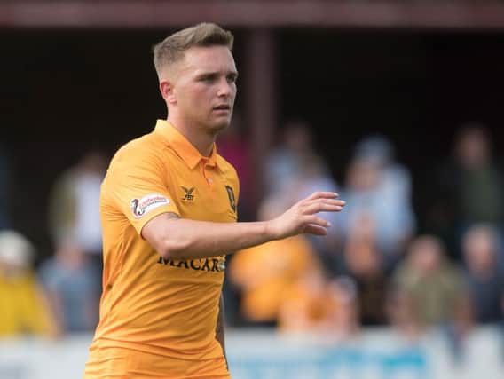 Callum Crane in action for Livingston during a Betfred Cup clash