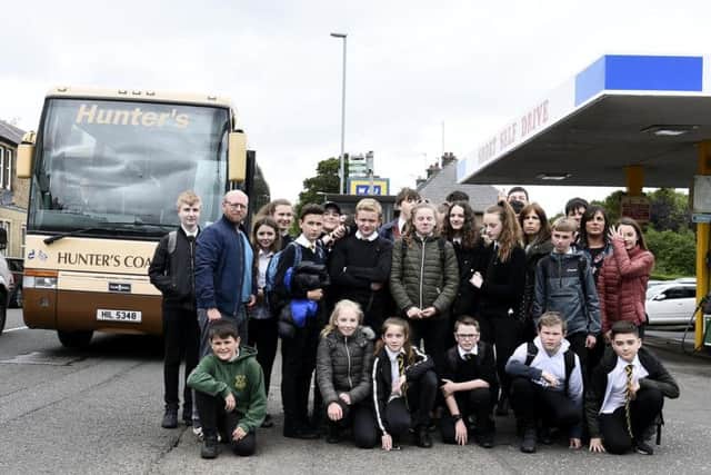 Parents say it is wrong to expect children as young as 11 to walk three miles with heavy backpacks along busy routes twice a day in all weathers.