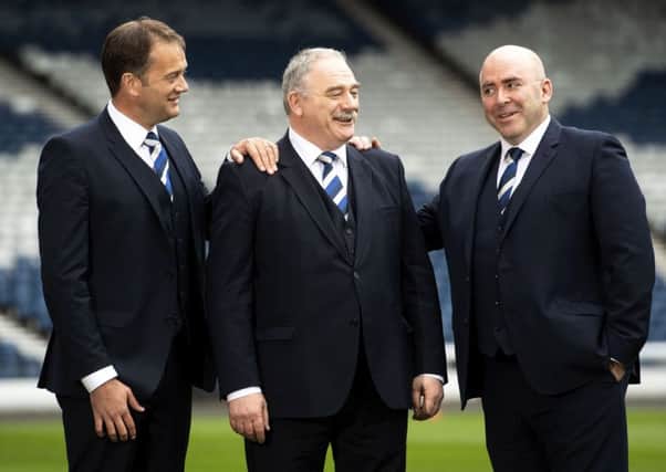 Scottish FA chief executive Ian Maxwell, left, Rod Petrie, the SFAs new president and current Hibs chairman, centre, and Mike Mulraney, the  new vice-president and current Alloa chairman