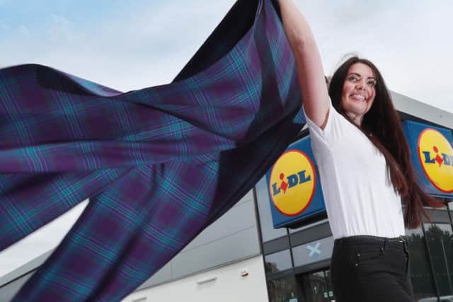 Norma Douglas, Assistant Personnel Team Manager at Lidl launches the new tartan.