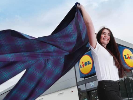 Norma Douglas, Assistant Personnel Team Manager at Lidl launches the new tartan.