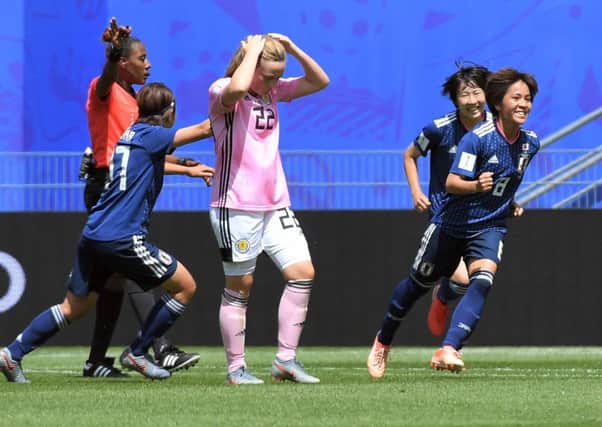 Scotland's Erin Cuthbert shows her frustration after Mana Iwabuchi, right, put Japan ahead in Rennes