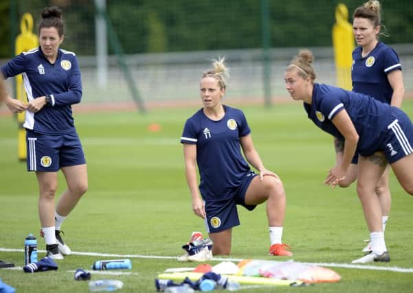 Scotland players, from left, Leanne Crichton, Joelle Murray and Nicola Docherty limber up in training. Pic: Lorraine Hill
