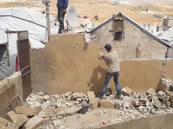Syrian refugees in the Arsal camp have been ordered to tear down their building over what the Lebanese authorities have called "security risks"