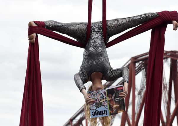 Aerial artist Blaise Donald, at the Forth Bridge, at the launch of the Fringe. Picture: Lisa Ferguson/TSPL
