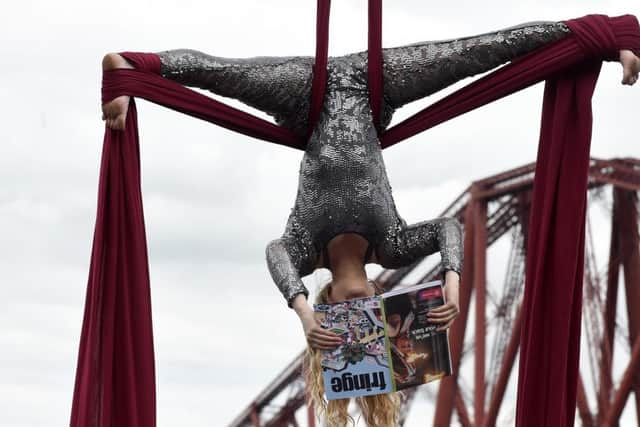Aerial artist Blaise Donald, at the Forth Bridge, at the launch of the Fringe. Picture: Lisa Ferguson/TSPL