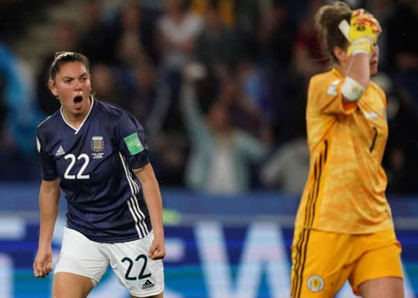 Milagros Menendez celebrates after scoring while a despondent Lee Alexander hangs her head. Picture: AFP/Getty Images