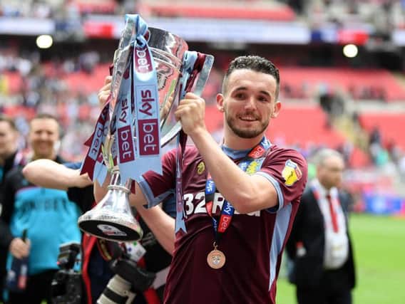 John McGinn celebrates Aston Villa winning promotion to the English Premier League
