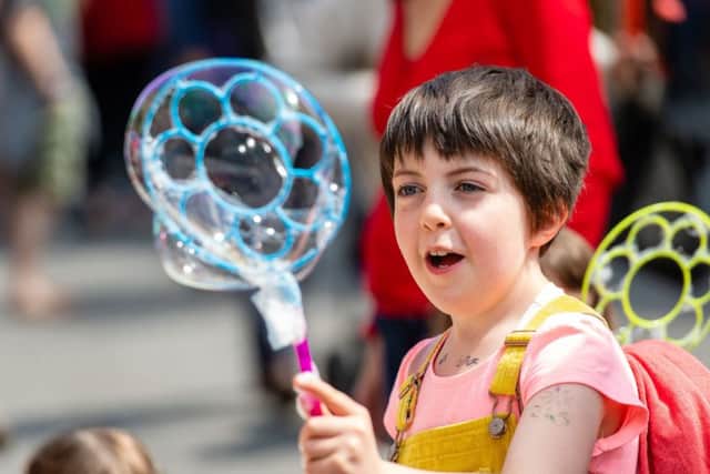 Fun with bubbles at the Stockbridge Summer Solstice. Picture: Ian Georgeson
