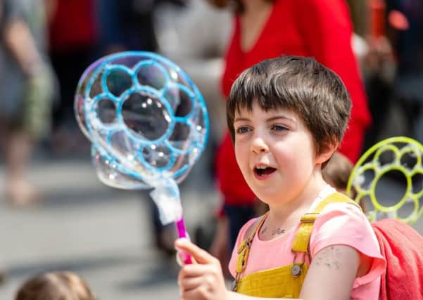 Fun with bubbles at the Stockbridge Summer Solstice. Picture: Ian Georgeson