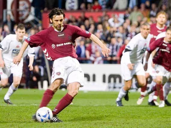 Paul Hartley's converts one of his most important penalties in his Hearts career. Picture: SNS