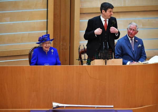 Queen Elizabeth II listens to Ken Macintosh, Presiding Officer of the Scottish Parliament, as she attends a ceremony to mark the 20th Anniversary of the Scottish Parliament. Picture: Jeff J Mitchell - WPA Pool/Getty Images.