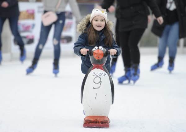 The Christmas ice rink is popular with both young and old. Picture: Neil Hanna