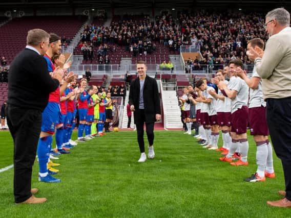 Angus Beith is welcomed on to the pitch ahead of Hearts' friendly with Inverness.