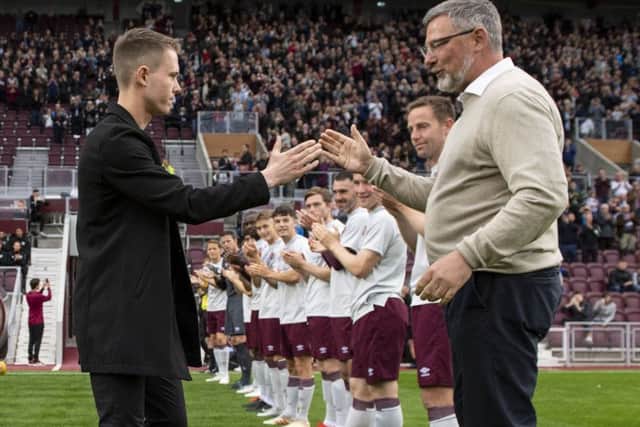 Former Hearts and Inverness midfielder Angus Beith shakes hands with Hearts manager Craig Levein before his benefit match. Pic: SNS