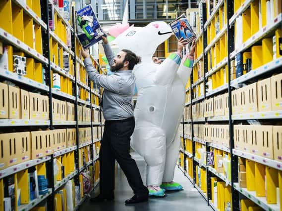 The Amazon fulfilment centre in Dunfermline stores, picks, packs and ships the firms products. Picture: Andy Buchanan