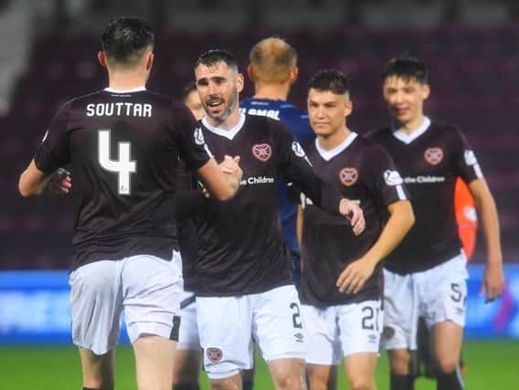 Michael Smith, centre, produced another impressive display for Hearts.