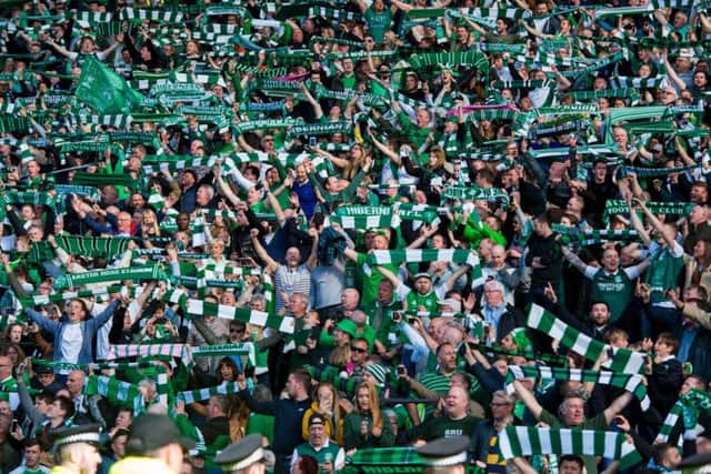 Hibs fans celebrate after defeating Rangers in the 2016 Scottish Cup final.